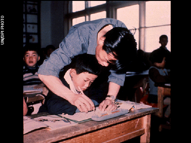 Teacher and student in classroom photo used on Voyager Golden record