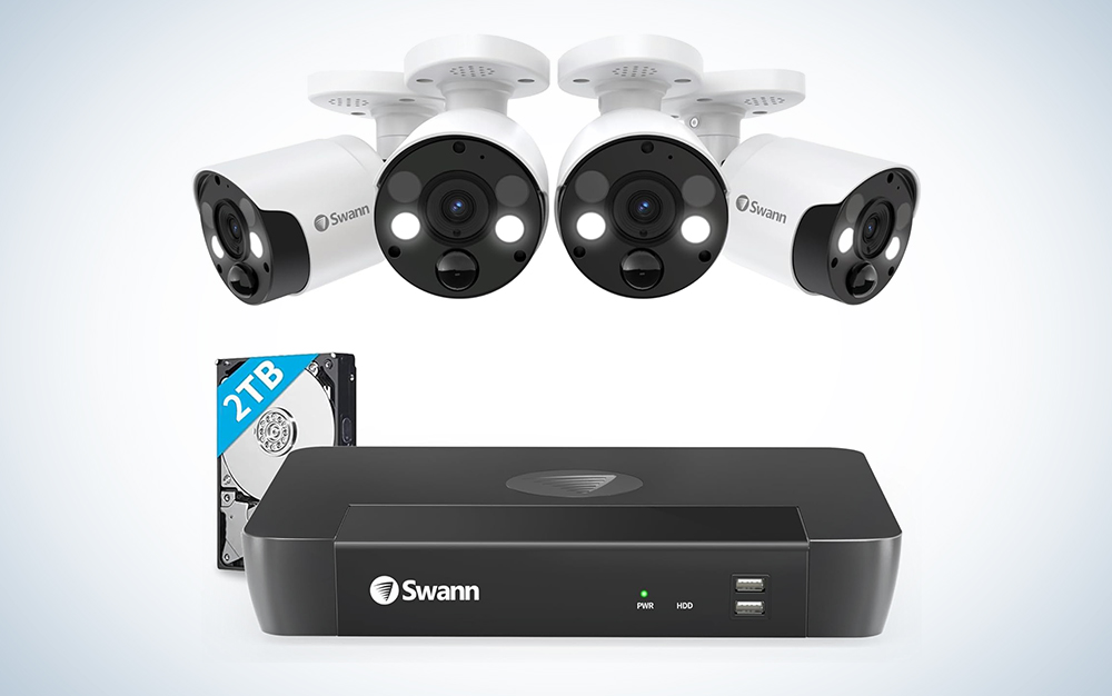 Swannâ€™s 8-Channel/4-Camera Home Security Camera System with four cameras over a white background