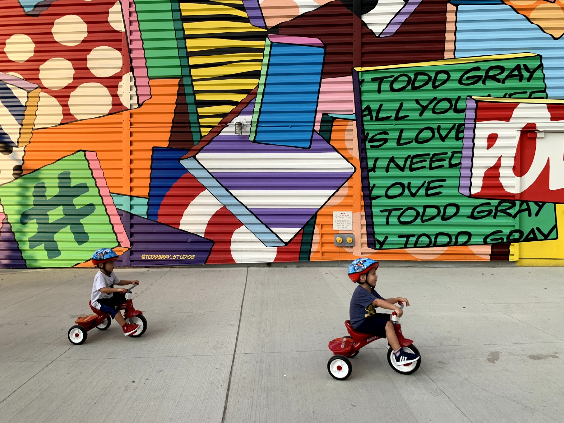 Kids on trikes shot with iPhone XS Max