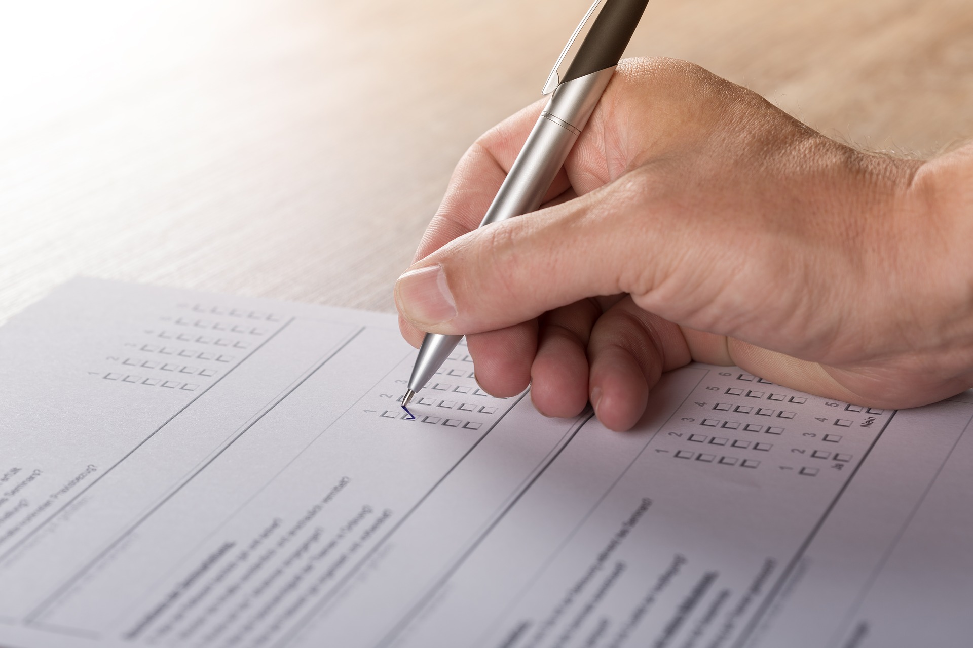 a person marks a ballot