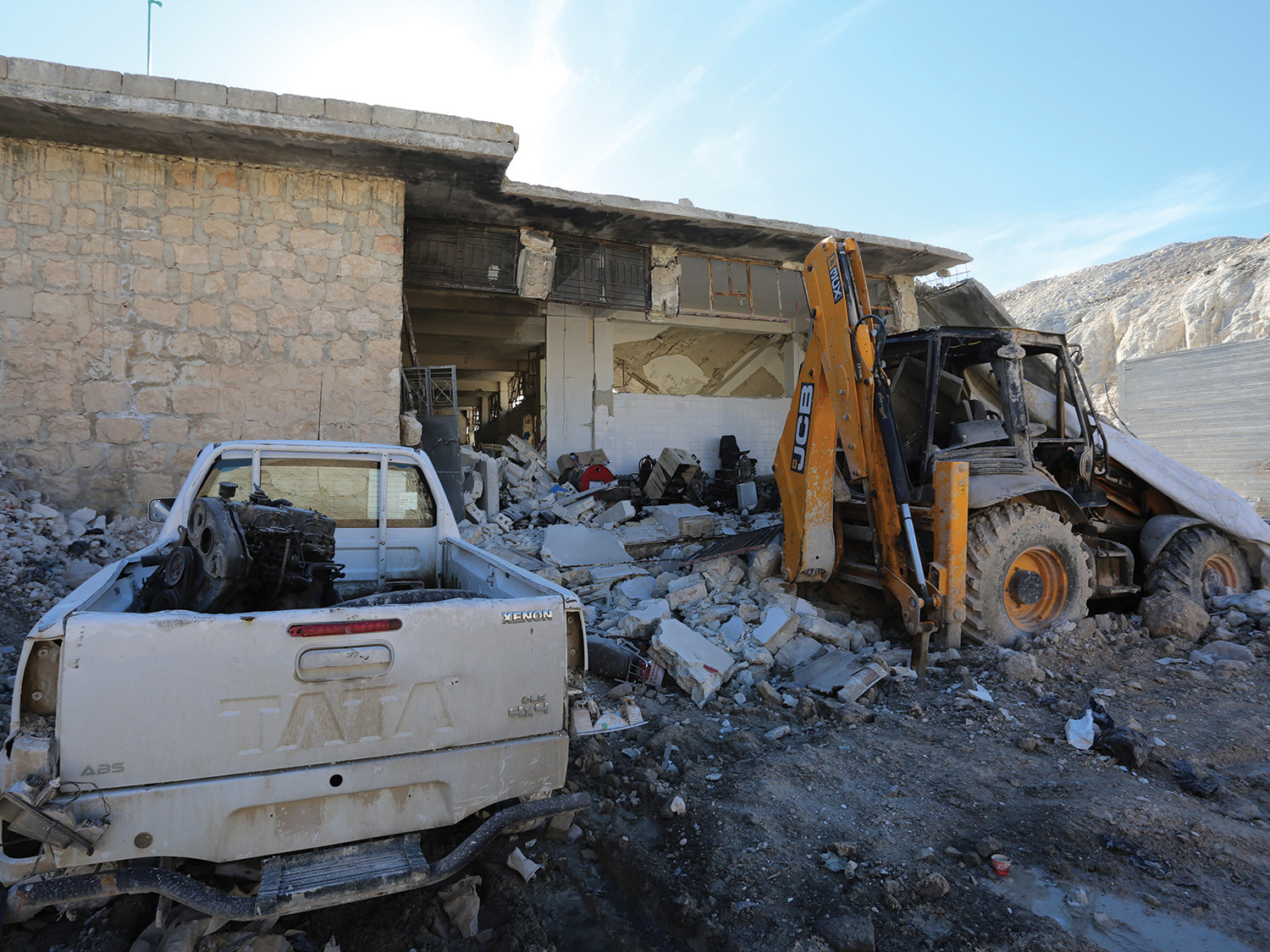 truck in house rubble