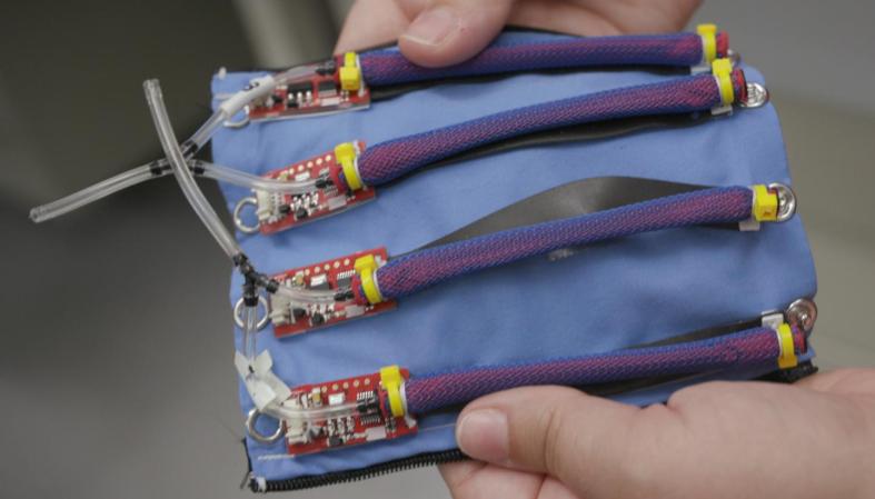 A piece of blue fabric with electronics attached