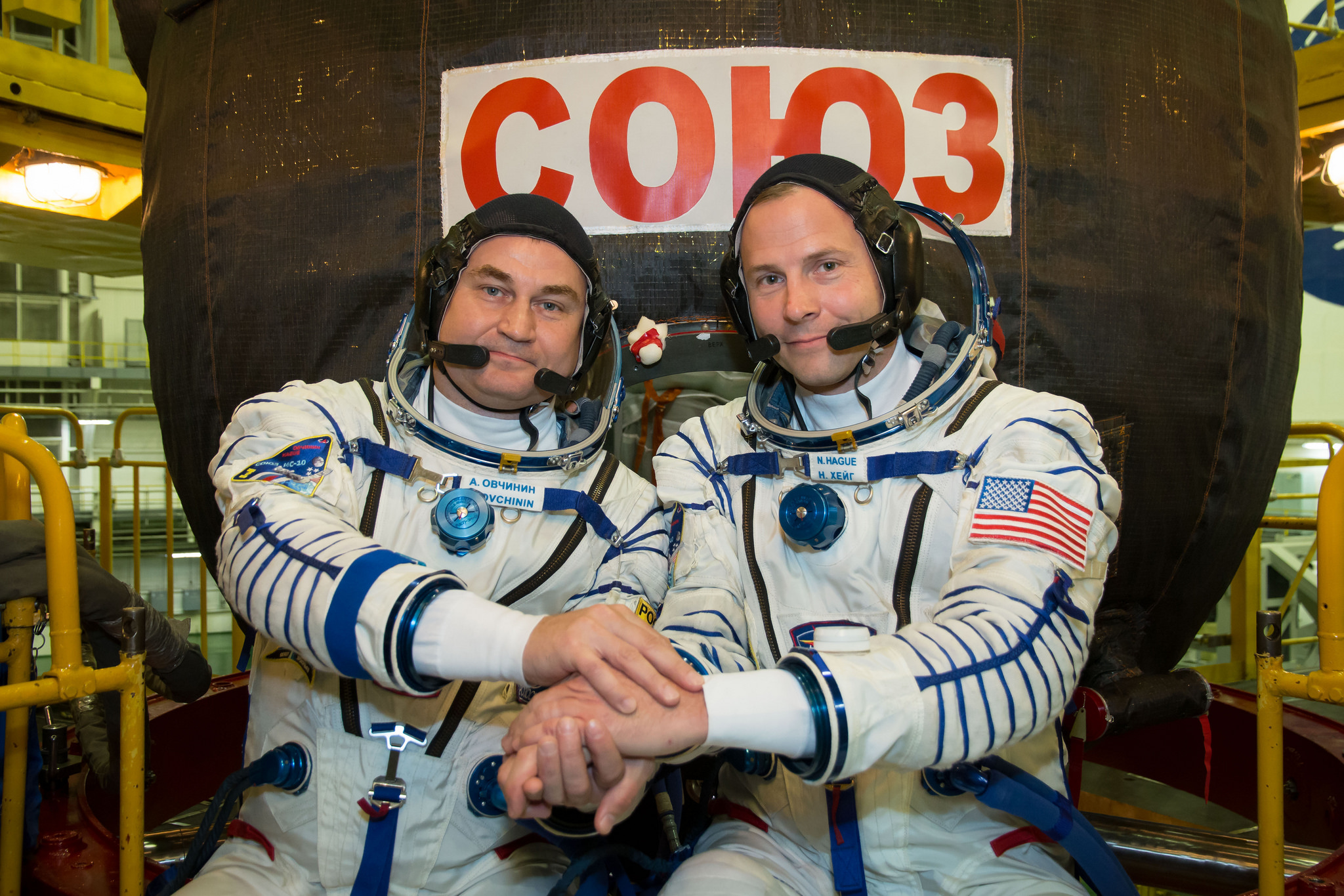 two astronauts posing together 