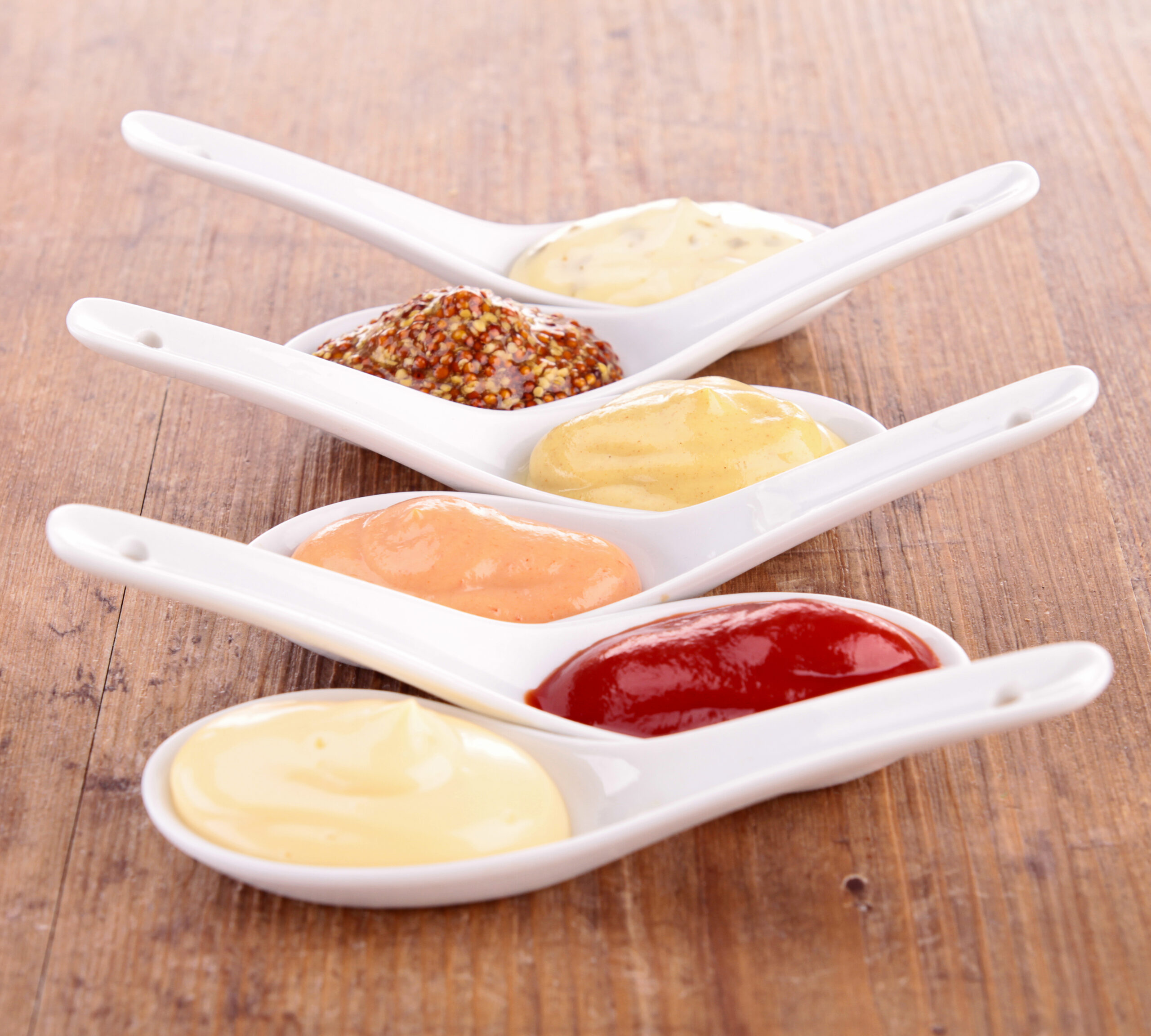 spoons full of condiments 