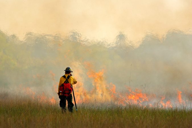 fireman standing near smoke