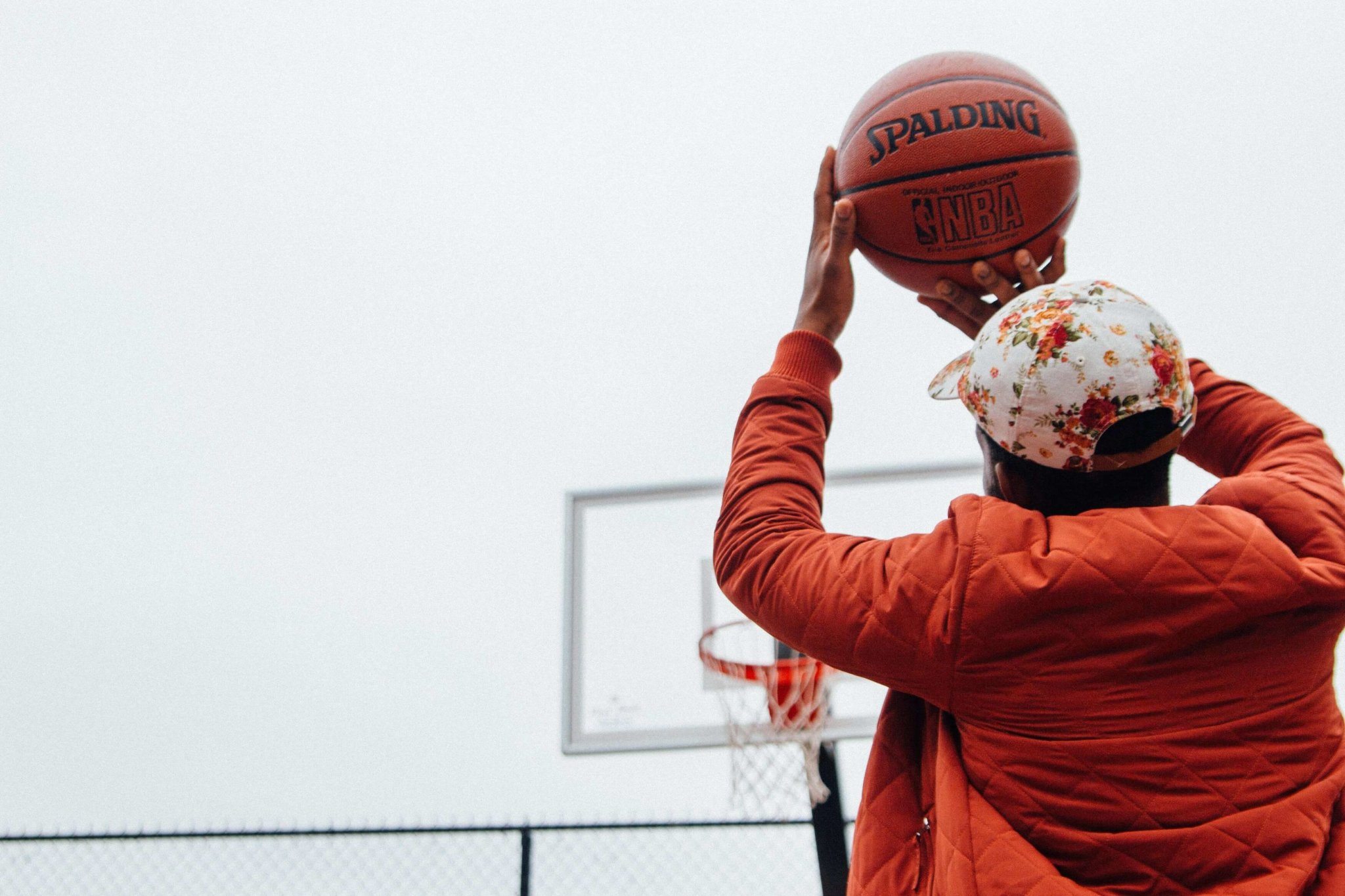 man taking basketball shot