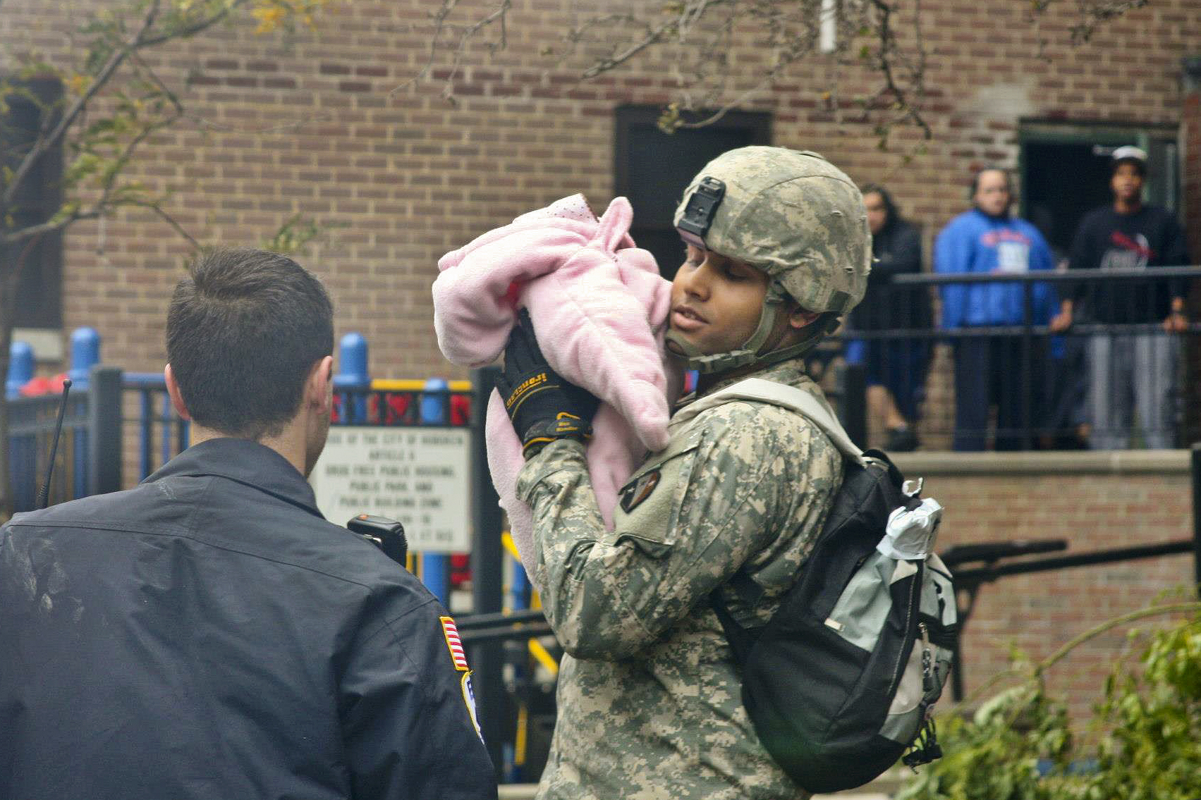 A National Guard soldier holds a baby displaced by Hurricane Sandy in Hoboken, NJ, October 31, 2012.