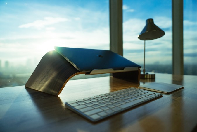 Laptop propped up on desk