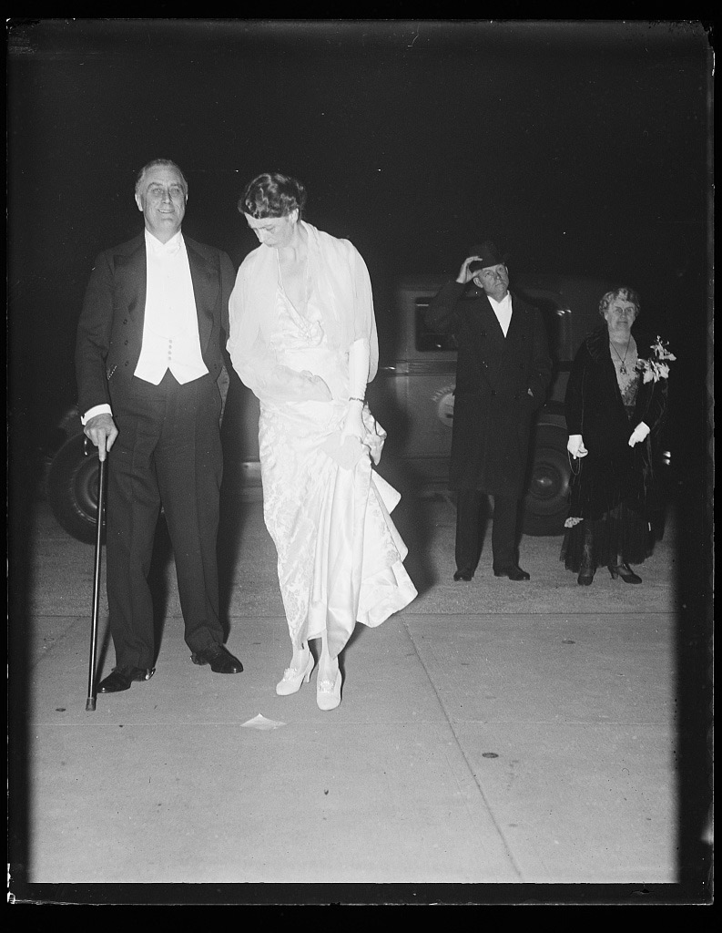 Franklin Roosevelt (standing with cane) and Eleanor Roosevelt