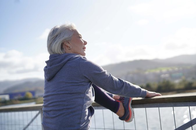 older woman stretching exercise