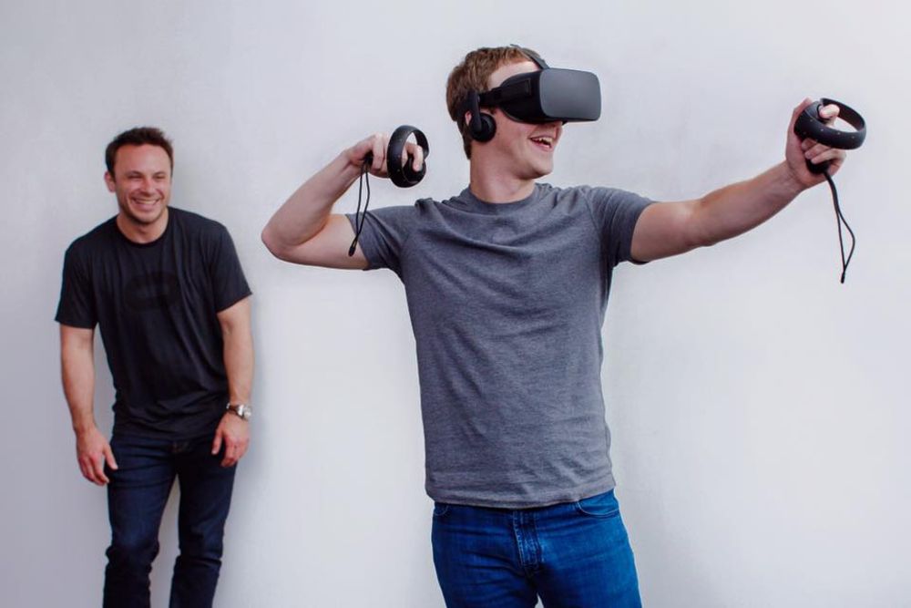 Mark Zuckerberg wears an Oculus Rift virtual reality headset