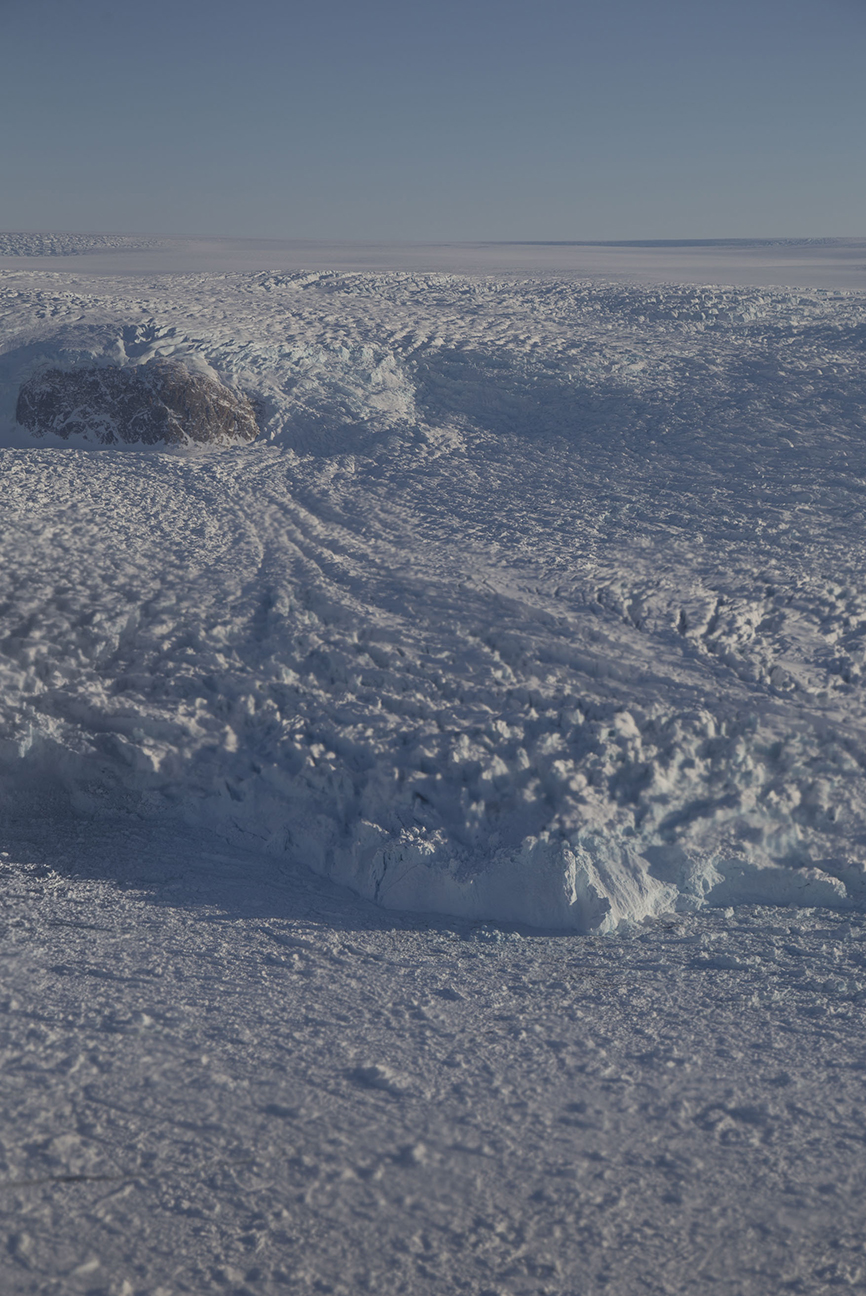 Ice flowing around a rock