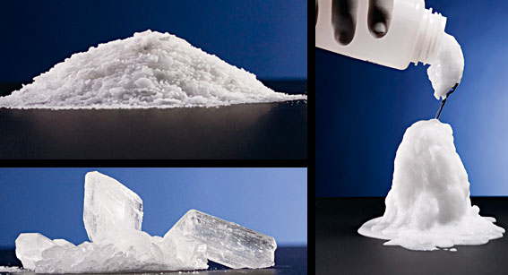 Clockwise from bottom left: white sodium acetate crystals, a pile of raw white sodium acetate, and a person wearing black gloves pouring a white bottle of water into a lump of solid white sodium acetate.