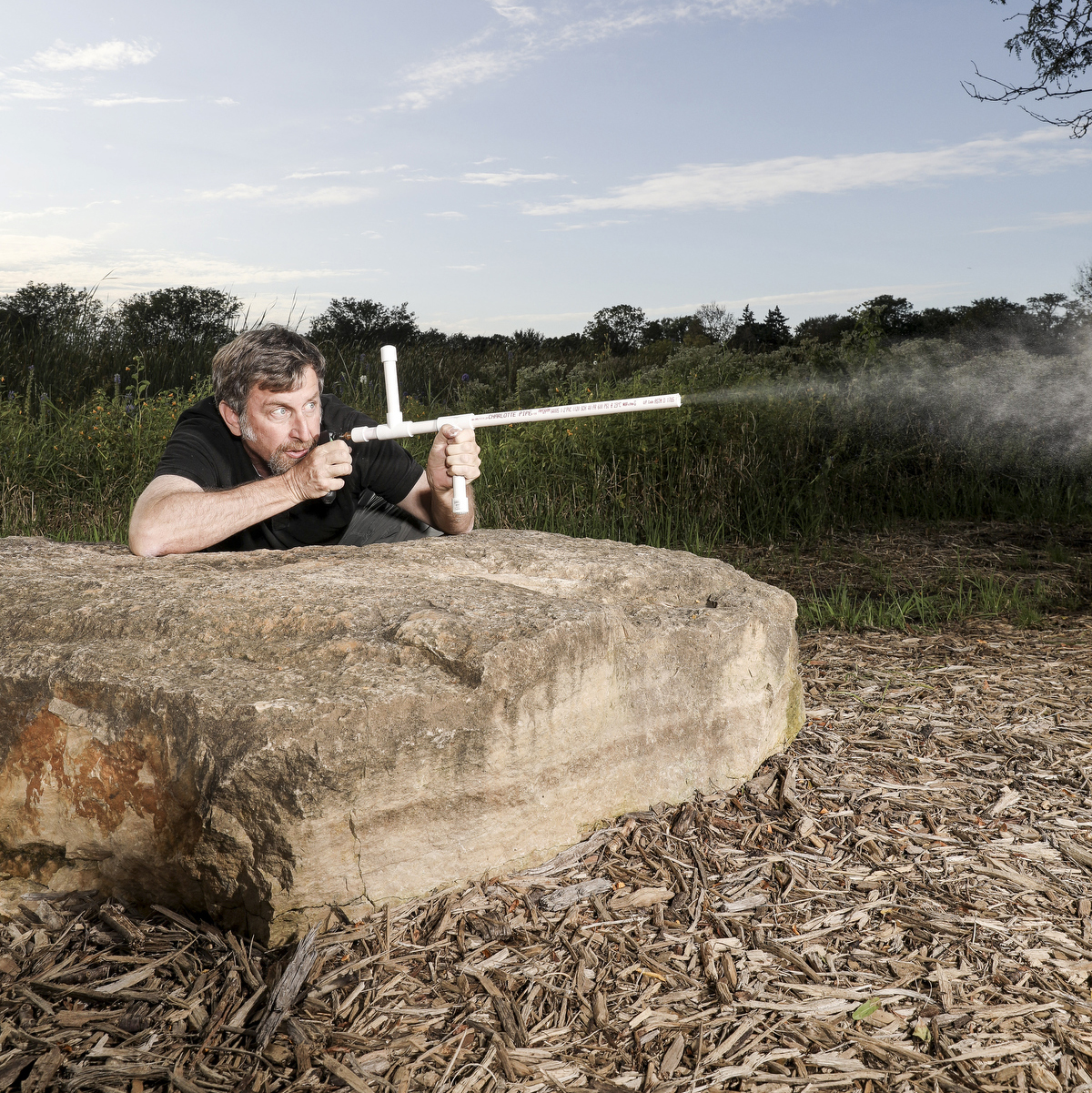 The author fires his gas-powered marshmallow shooter