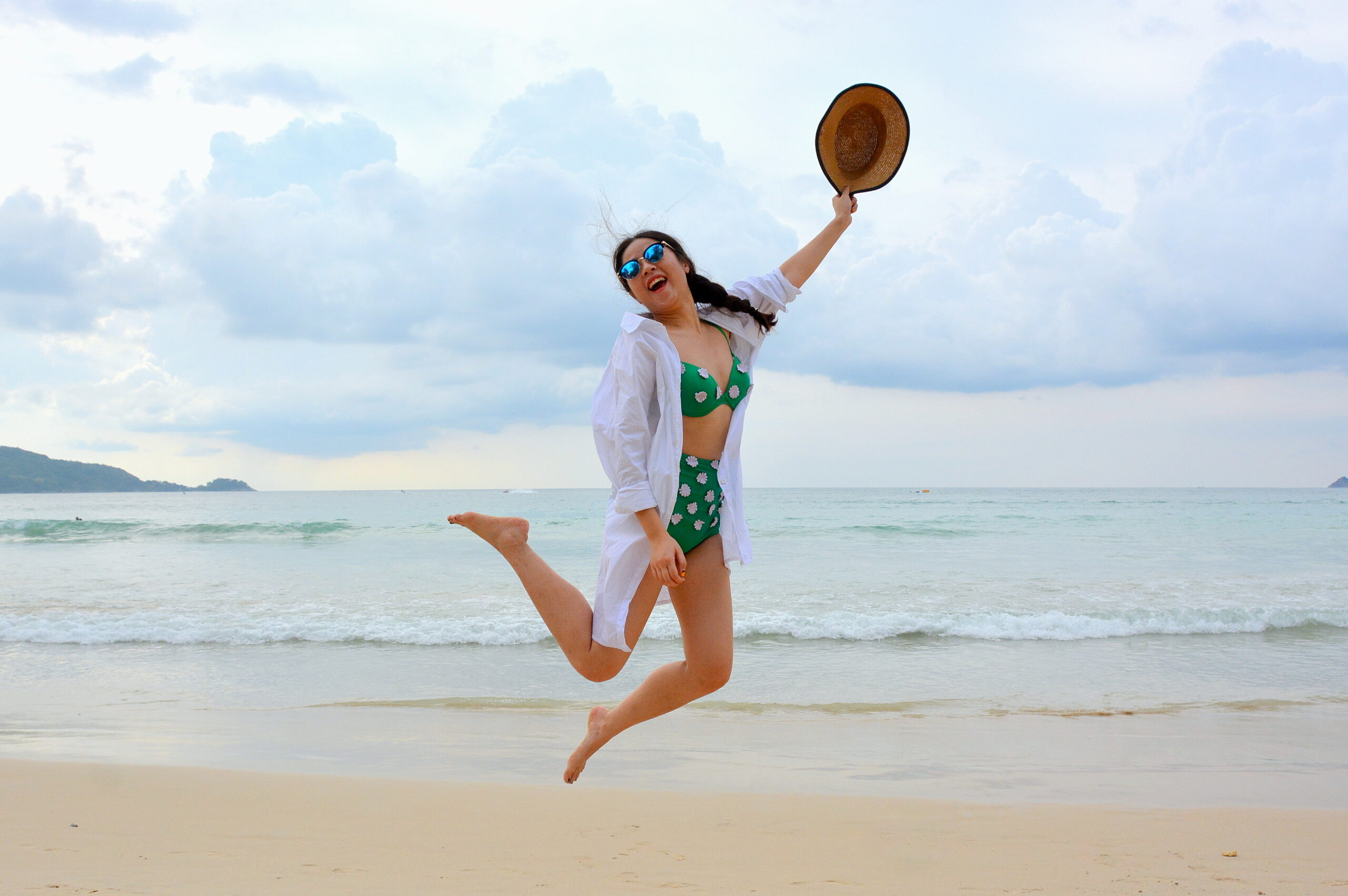 Woman jumping on beach