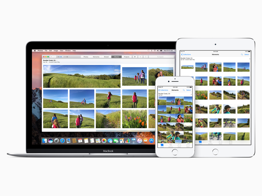 A laptop, phone, and tablet using Apple iCloud to store photos.