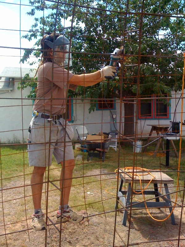 Cutting rebar with angle grinder to make room for window in dome home