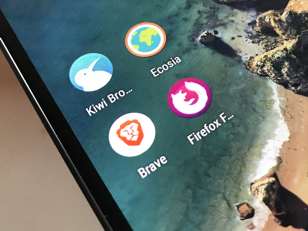 A phone screen with the Kiwi Browser, Ecosia browser, Brave browser, and Firefox browser icons on the screen.