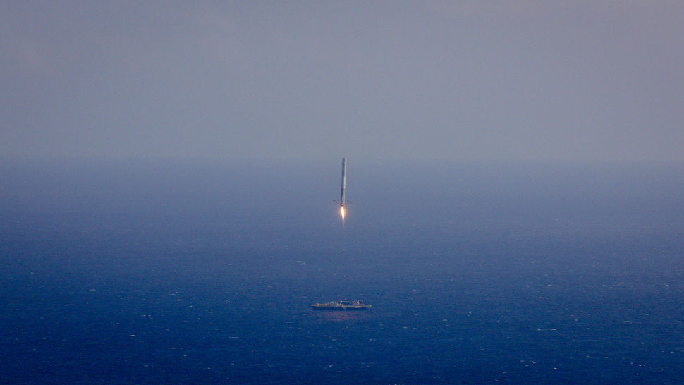 SpaceX Falcon 9 landing on a barge in the middle of the ocean