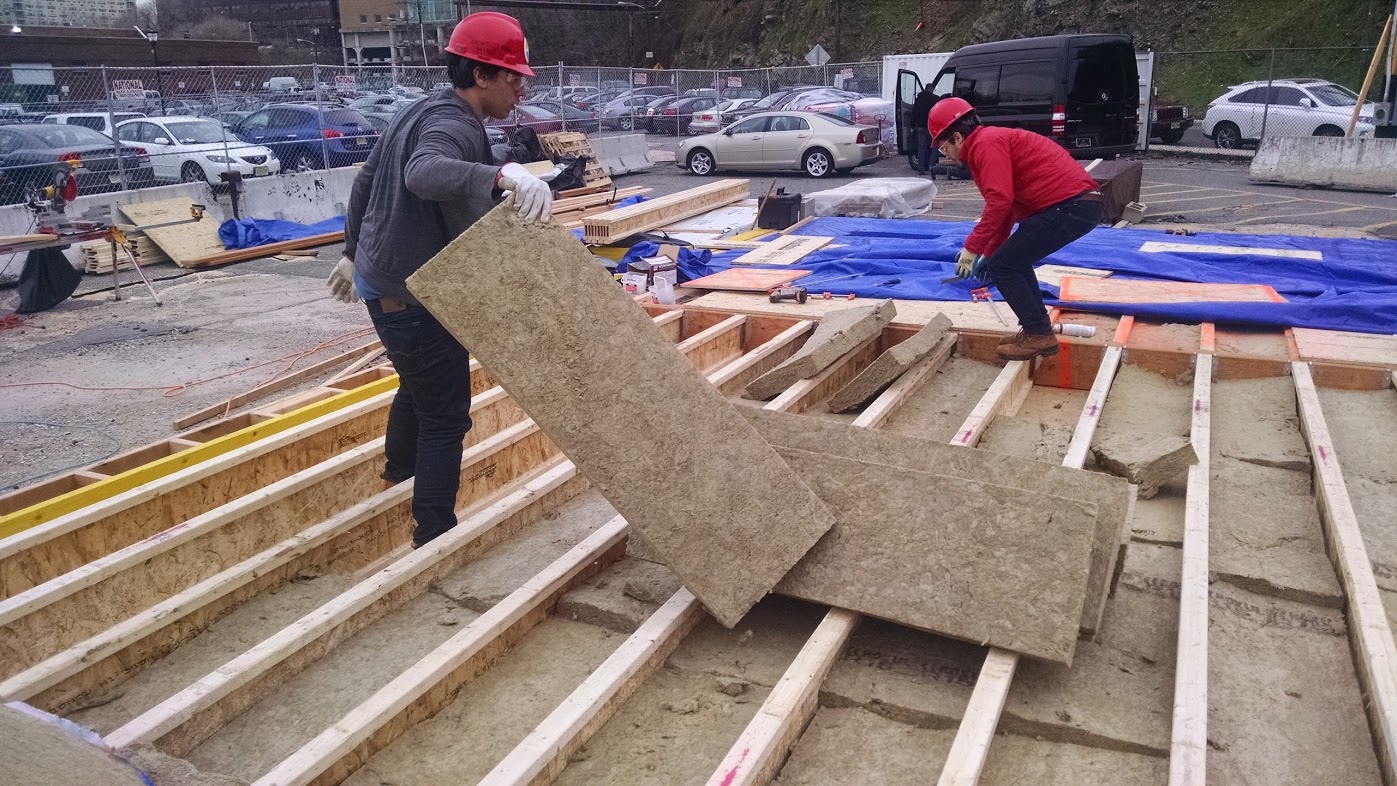 workers setting up floor insulation