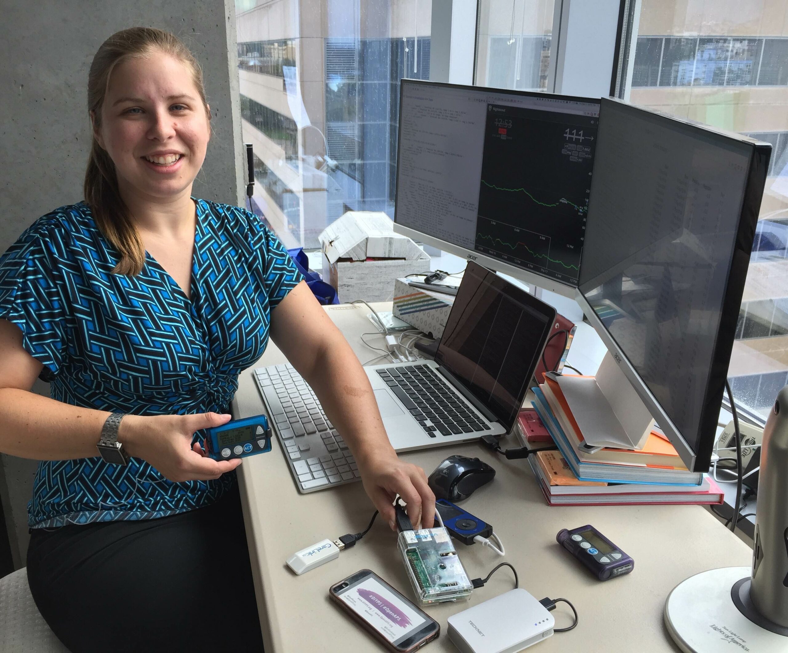 Dana Lewis smiling in her office