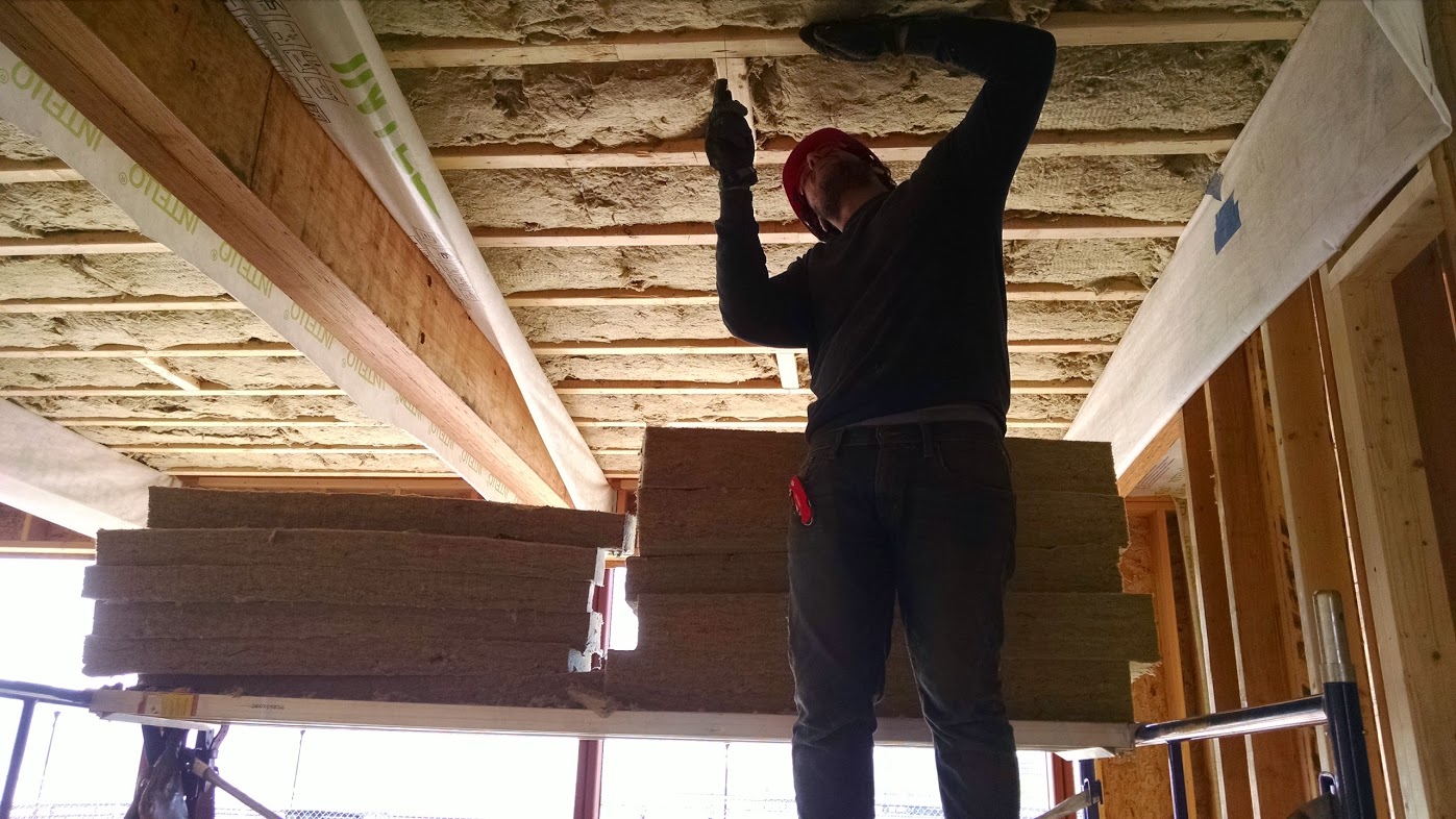 construction worker setting up insulation