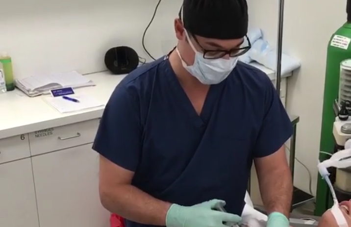 Screenshot from Buzzfeed Facebook Live video of skin-tightening surgery