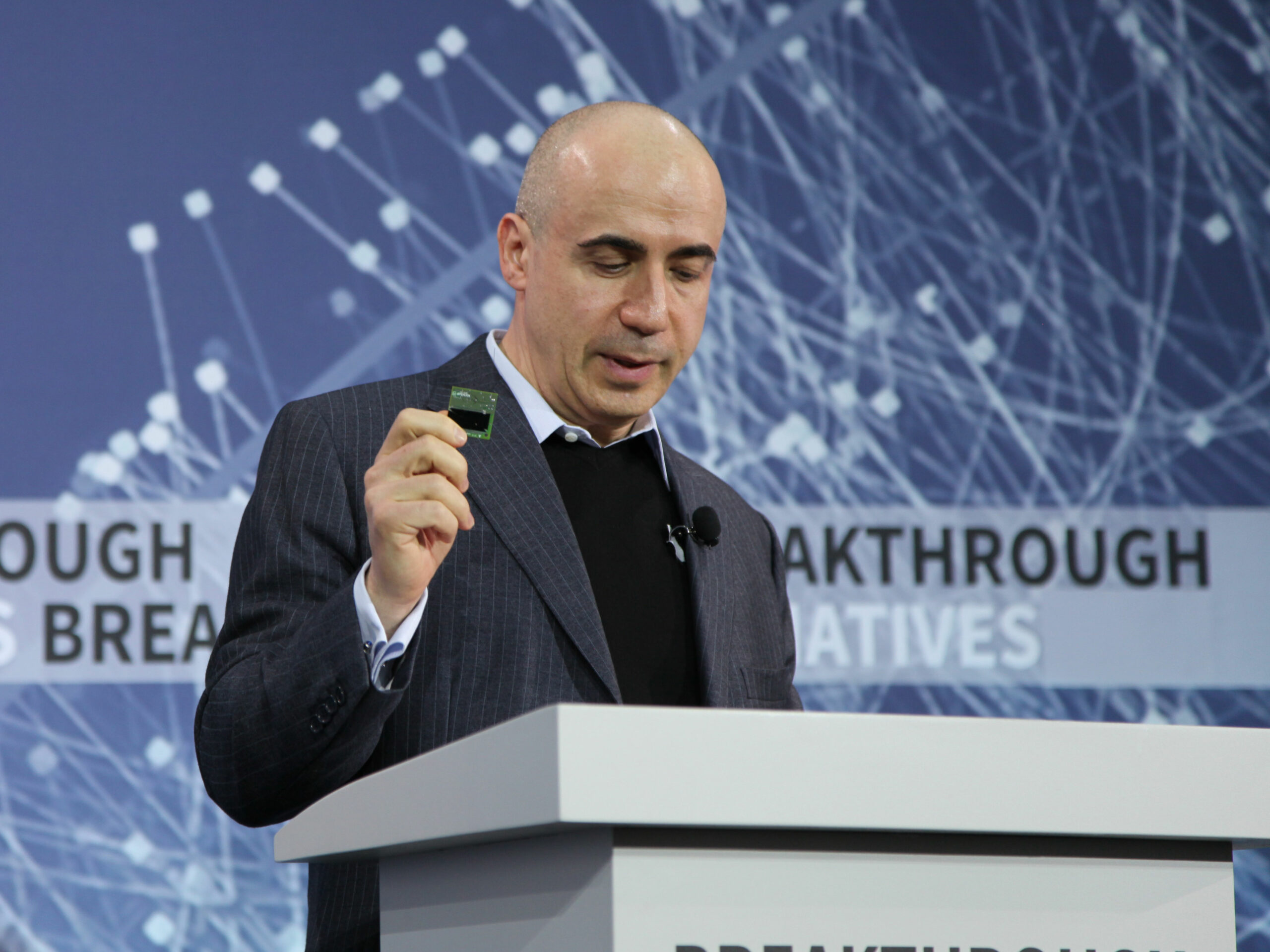 yuri milner holds a "star-chip"