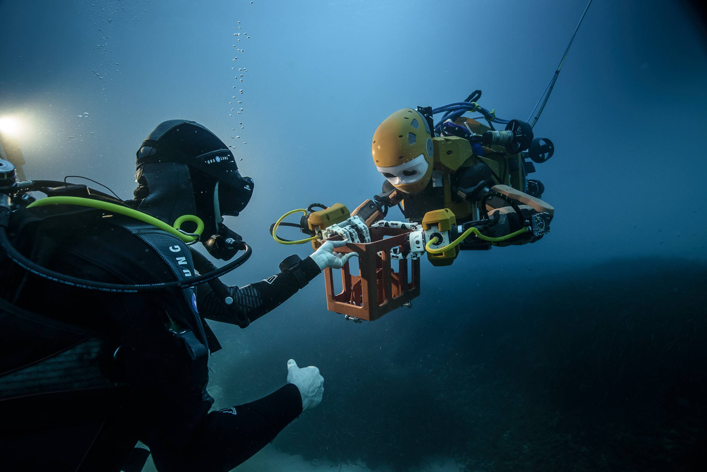OceanOne and a human diver working together under water