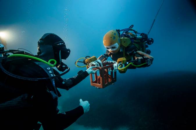 OceanOne and a human diver working together under water