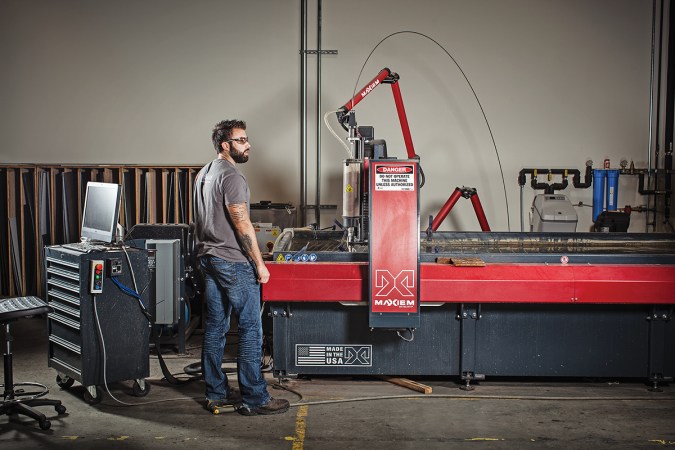 Justin Blair, a maker at FirstBuild, operates the Maxiem waterjet