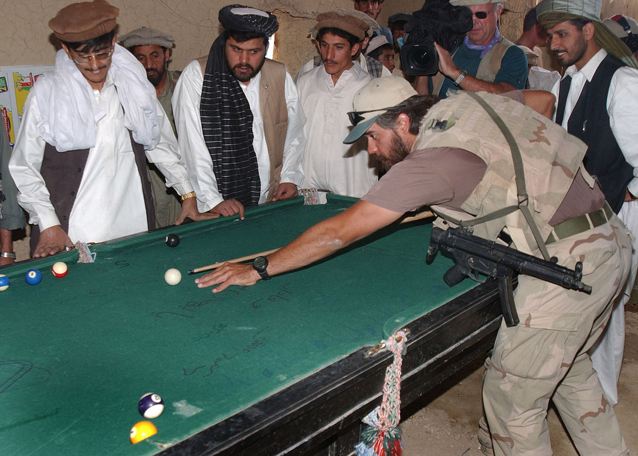 Special Forces Soldier Plays Pool In Afghanistan