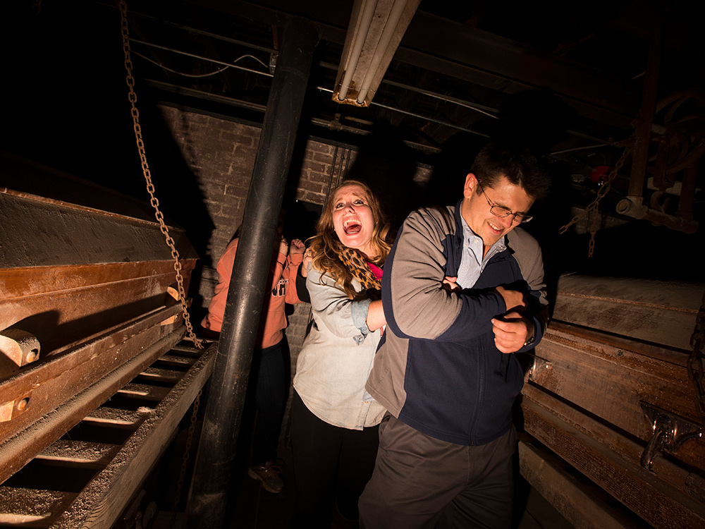 man and woman in haunted house