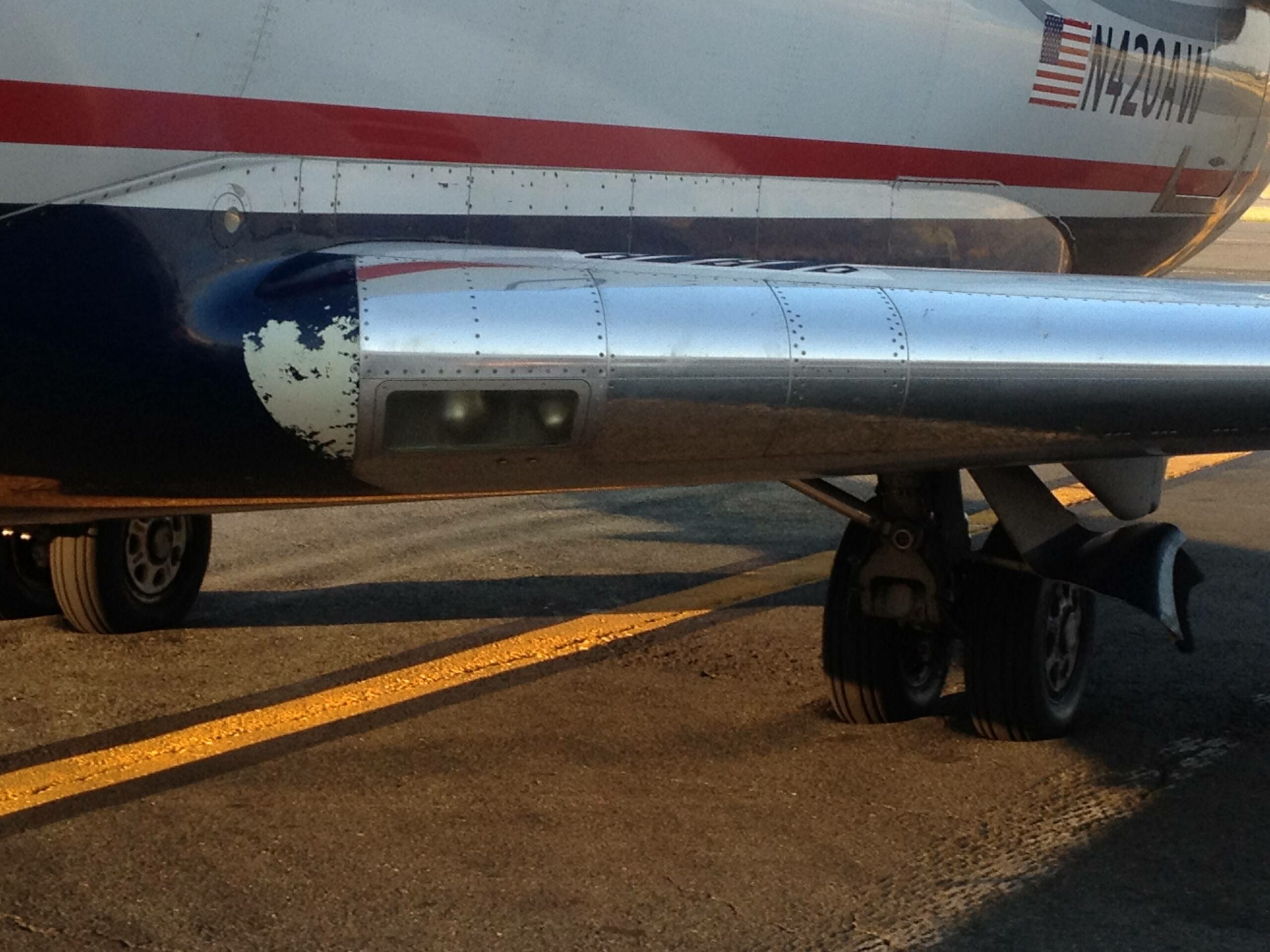 Plane wheels sinking in tarmac.