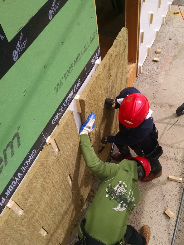 Men setting Exterior Insulation