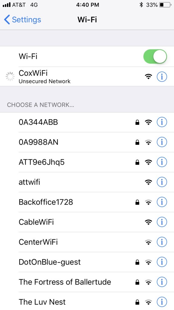 An iPhone WiFi settings menu showing a connection to a Cox WiFi hotspot.