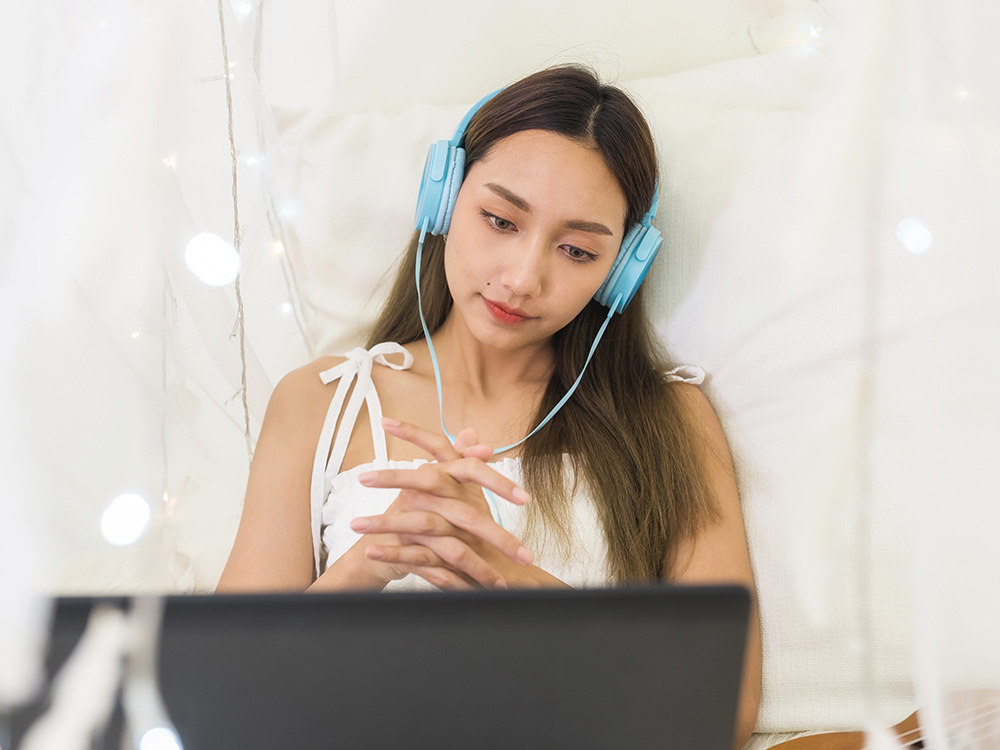 girl listening to headphones