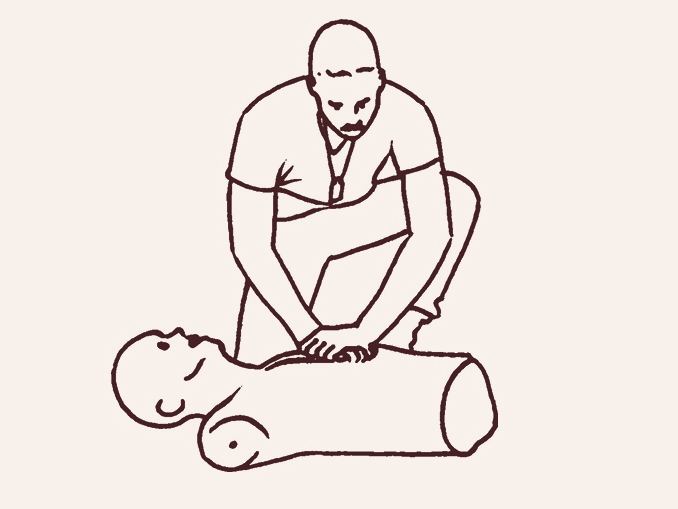 man performs CPR on a dummy