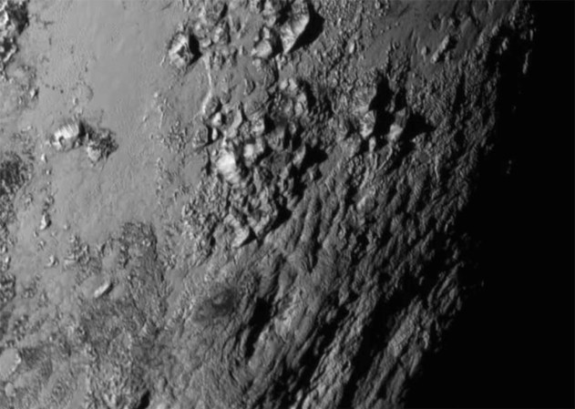 Pluto's surface is covered by young, icy mountains