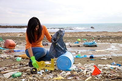 httpswww.popsci.comsitespopsci.comfilesimages201707woman_-_beach_clean_up.jpg