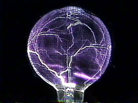 A light bulb wrapped in mesh, creating dangerous lightning.