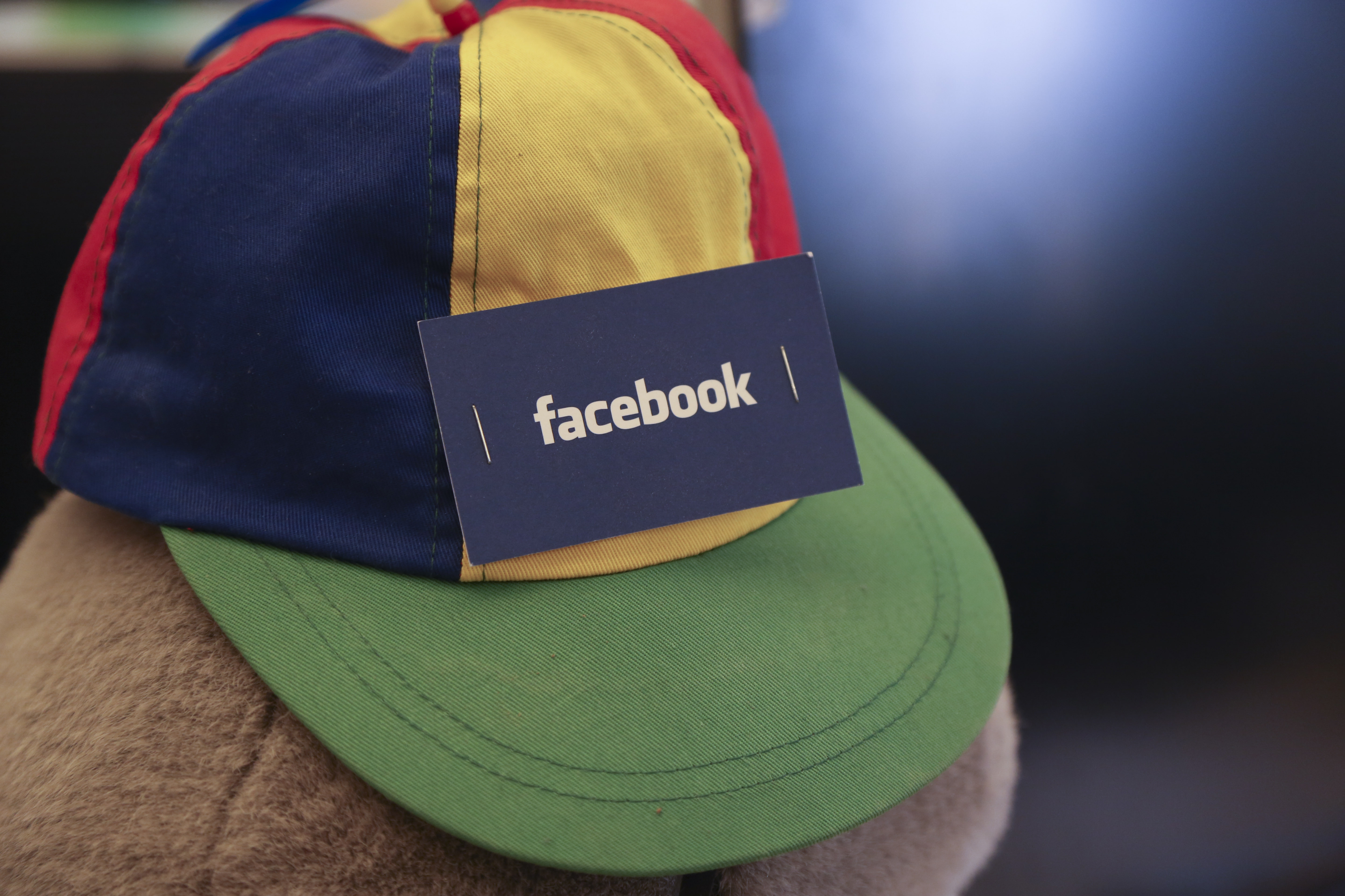 facebook card stapled to hat