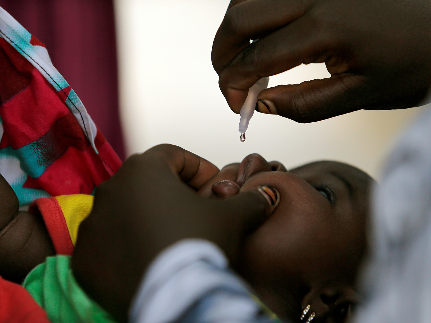 A child is vaccinated in Nigeria