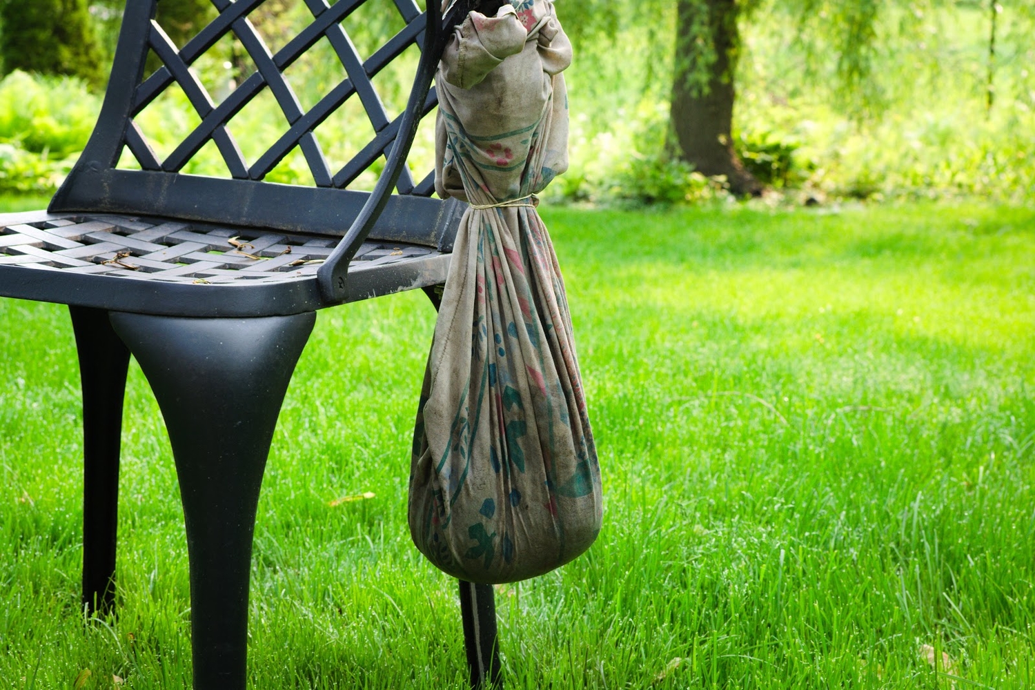 clay drying in a cloth bag outside