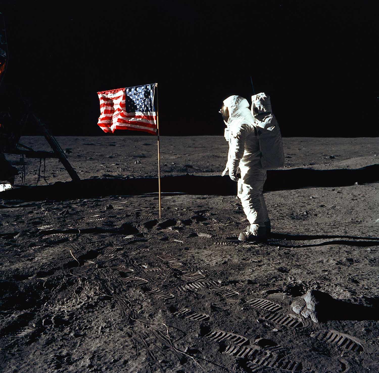 Man on the moon with an American Flag