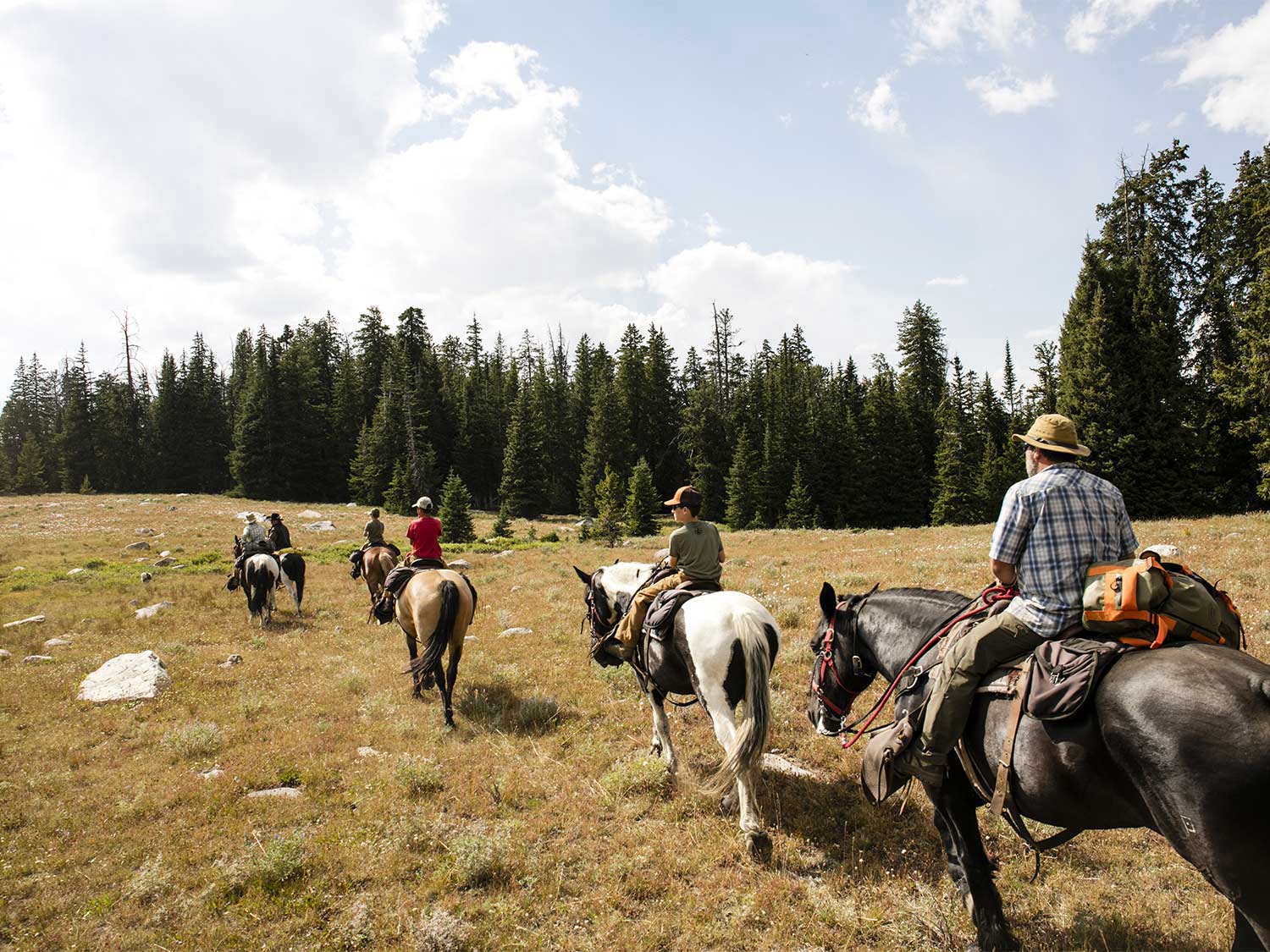 a group of people on horses