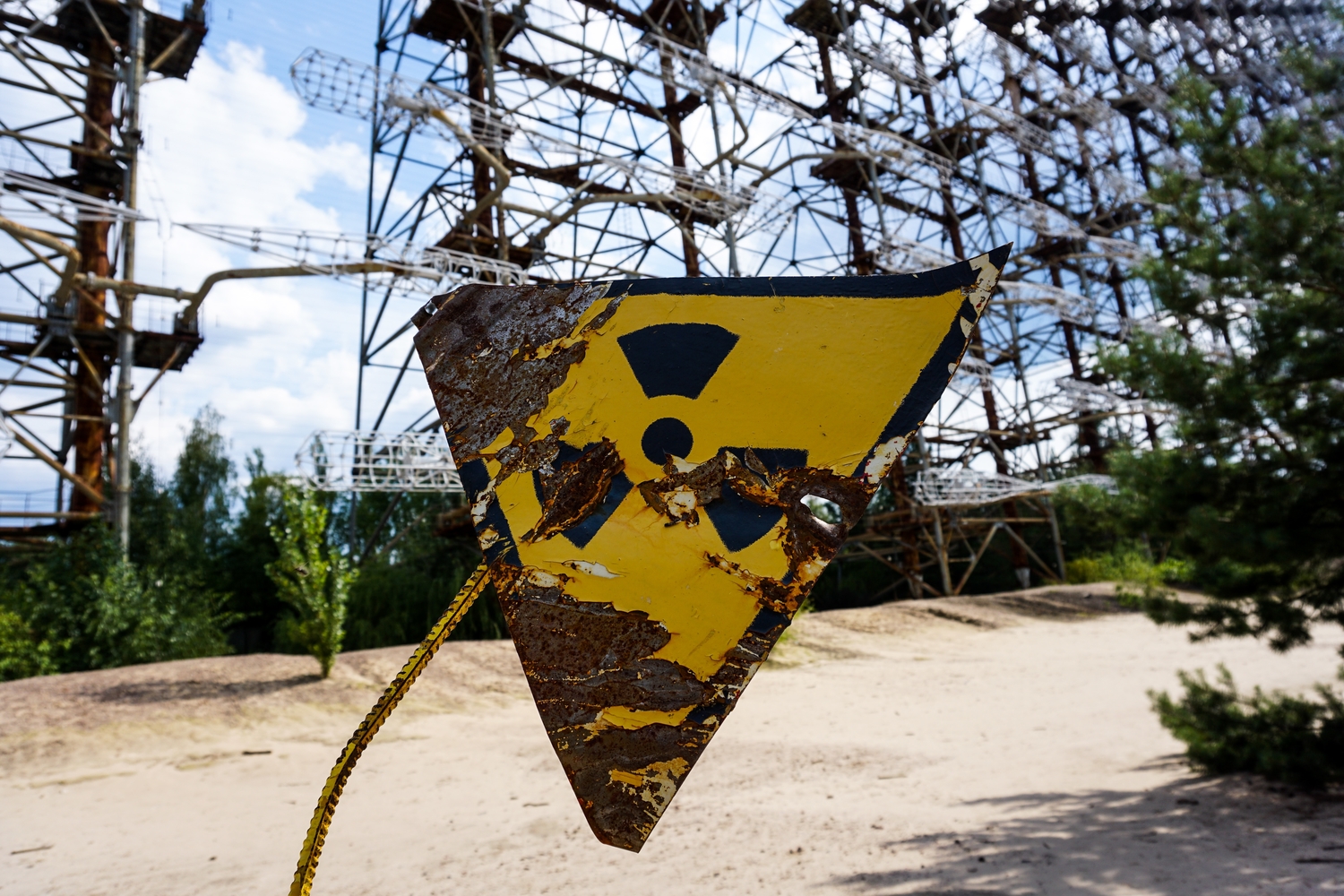 a damaged nuclear radiation hazard warning sign in Pripyat, Ukraine