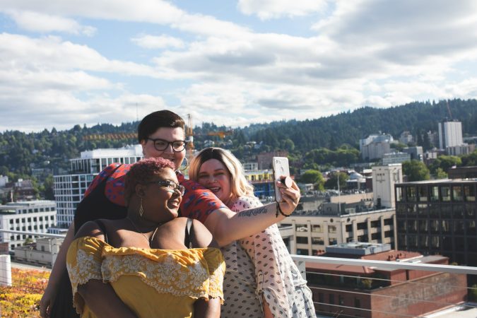 three plus-size women take a selfie