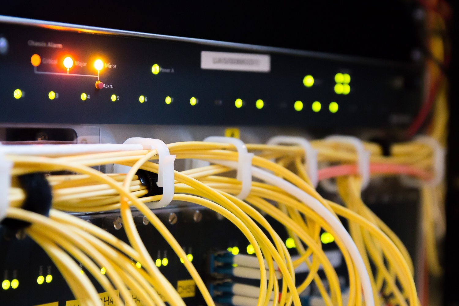 back of a router with lots of yellow cables