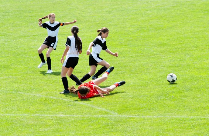 kids playing soccer aggressively